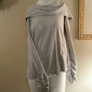 The grey off-the-shoulder sweatshirt